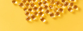 Banner closeup of oil gel capsules on yellow background. - PhotoDune Item for Sale