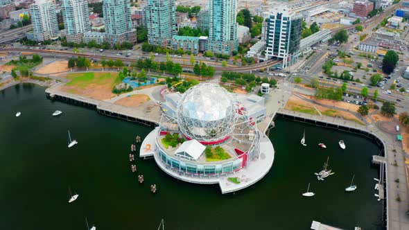 Bird's Eye View Of Science World At Telus World Of Science With Boats On False Creek In Vancouver, C