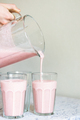 Strawberry milkshake pouring in glass. - PhotoDune Item for Sale