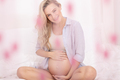 Happy Pregnant Woman with Pink Bokeh - PhotoDune Item for Sale