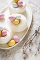 Easter meringue nests with colorful sweet eggs on plate. - PhotoDune Item for Sale