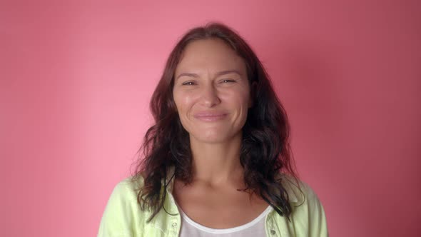 Woman Looking at Camera with Sarcastic Smile