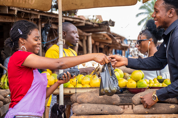 People buying and selling in a local African market