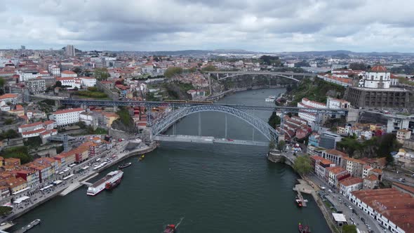 Aerial View Of Dom Luis I Bridge Between The City of Porto And Vila Nova de Gaia Over Douro River In
