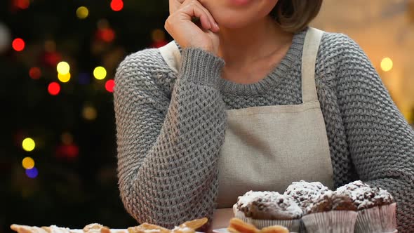 Woman Serves Festive Table With Homemade Pastries