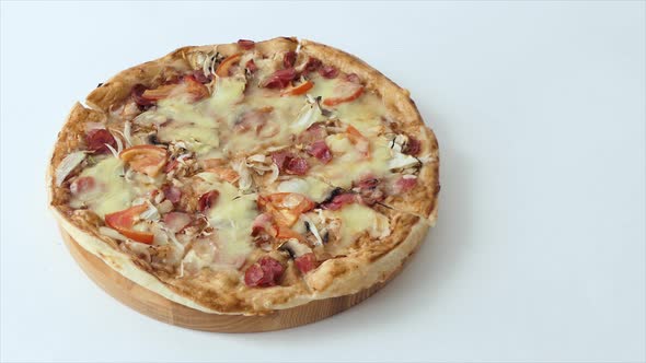 Top View Male Hand Takes a Slice of Pizza with Cheese Tomatoes and Ham From Food Delivery