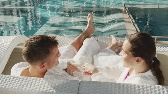 Couple Flirting At Poolside