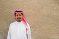 Portrait of an Arabic man with a plain beige wall background - PhotoDune Item for Sale