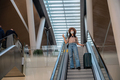Beautiful young woman travels posing at airport during her trip - PhotoDune Item for Sale