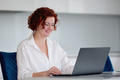 Beauitul young woman working using computer laptop concentrated and smiling - PhotoDune Item for Sale