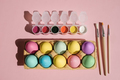Tray with pastel-colored Easter eggs on a pink background - PhotoDune Item for Sale