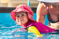 2-3 years old child with mother in swimming pool learn to swim. Summer at home concept. - PhotoDune Item for Sale