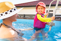 2-3 years old child with mother in swimming pool learn to swim. Summer at home concept. - PhotoDune Item for Sale