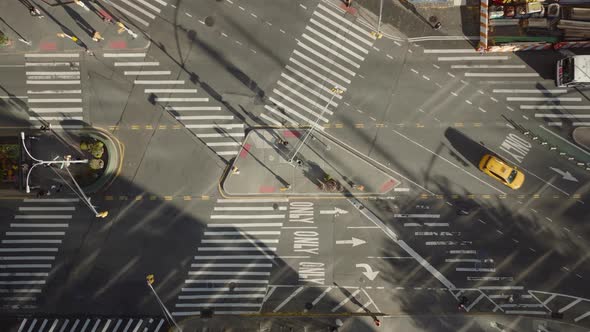 Aerial Birds Eye Overhead Top Down Ascending Footage of Pedestrians Crossing Street on Large