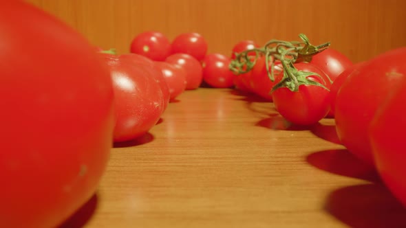 Movement Between Red Tomatoes on the Table