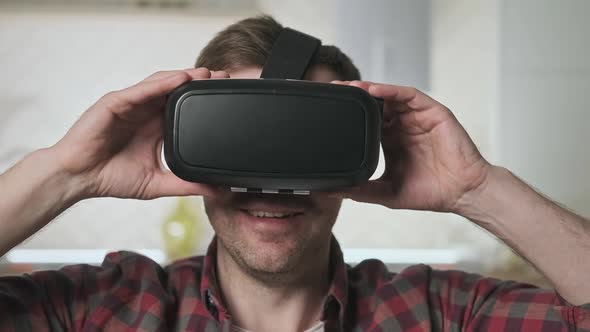 Man Wearing VR Headset at Living Room