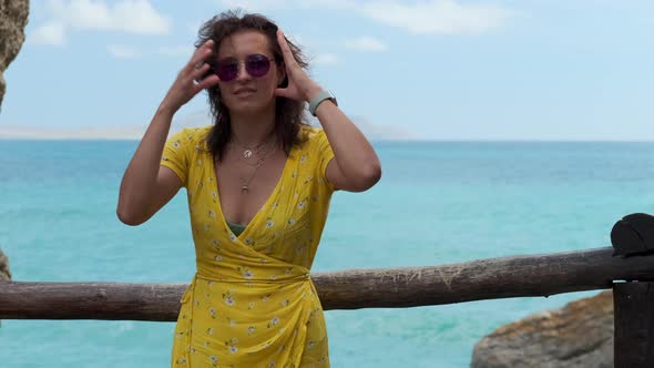 Summer Portrait of a Young Brunette Near the Sea