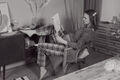 Young pregnant Woman reading a magazine while sitting in a chair. - PhotoDune Item for Sale