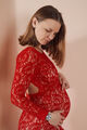 Beautiful young pregnant woman looking at her belly - PhotoDune Item for Sale