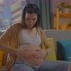 Pregnant Young Woman Uses Ointment or Body Lotion - VideoHive Item for Sale