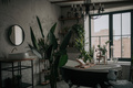 Luxury interior of eco style modern bathroom with oval bathtub and accessories at natural lighting - PhotoDune Item for Sale