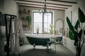 Luxury interior of eco style modern bathroom with oval bathtub and accessories at natural lighting - PhotoDune Item for Sale