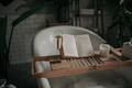 Luxury interior of eco style modern bathroom with oval bathtub and book on bamboo wood tray - PhotoDune Item for Sale