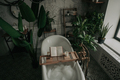 Luxury interior of eco style modern bathroom with oval bathtub and book on bamboo wood tray - PhotoDune Item for Sale