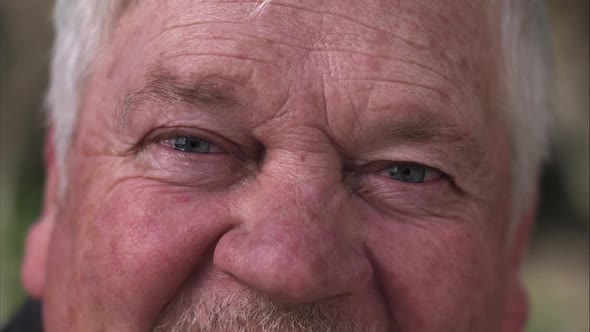 Up close view of older mans watering eyes