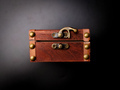 A locked mysterious wooden chest is on a black background. - PhotoDune Item for Sale