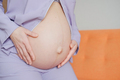 Close-up of pregnant woman keeping her hands on Belly - PhotoDune Item for Sale
