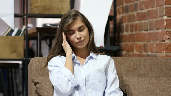 Headache, Girl Sitting on Sofa in Loft Office