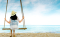 Asian woman in casual style wear hat and sandals sit on swings at sand beach  and looking sea - PhotoDune Item for Sale