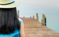 Back view of happy young Asian woman in casual style fashion and straw hat relax and enjoy holiday - PhotoDune Item for Sale