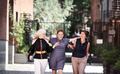 Smiling mature women. Happy group Middle aged female friends walking together city street - PhotoDune Item for Sale