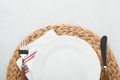 Vintage zero waste silverware. Rustic vintage set of white plate, wooden spoon and fork on napkin fo - PhotoDune Item for Sale