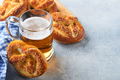 Bavarian pretzels and glass of lager beer. Oktoberfest food menu, traditional salted pretzels on lig - PhotoDune Item for Sale