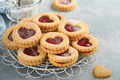 Traditional Linzer cookie with strawberry jam and powder sugar on light grey beautiful background. T - PhotoDune Item for Sale