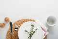 Vintage zero waste silverware. Rustic vintage set of white plate, wooden spoon and fork on napkin fo - PhotoDune Item for Sale