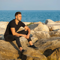 Man sitting on the rocks - PhotoDune Item for Sale