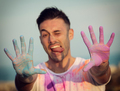 Man jumping with colored powder - PhotoDune Item for Sale