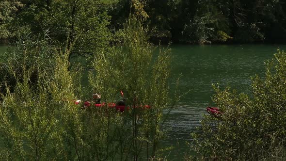 Friends enjoying riding canoe on river