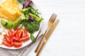 French omelet, avocado, tomatoes, avocado, and cheese on plate. - PhotoDune Item for Sale