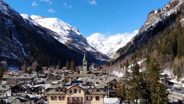 Aerial view of Alpine chapel in Gresonei Saint Jean Italy Aosta Valley. Winter season