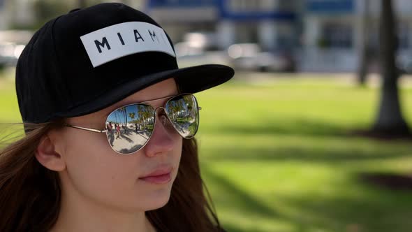 Young Pretty Woman Enjoys the Sun of Miami Beach