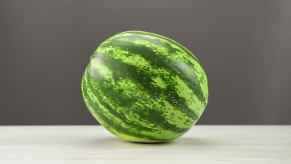 Appetizing Fresh Watermelon Rotating on Wooden Table Isolated Summer Seasonal Vitamin Dessert