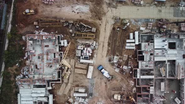 Aerial footage top-down view of construction site and machinery.