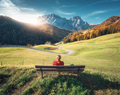 Young woman sitting on the bench and beautiful alpine village - PhotoDune Item for Sale