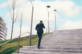 Young businessman outdoors walking stairs talking smartphone, - PhotoDune Item for Sale