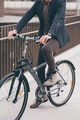 Unrecognizable contemporary stylish businessman going to work by bike - PhotoDune Item for Sale